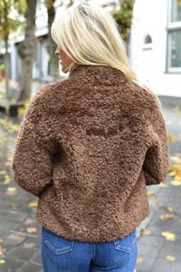 Houtje touwtje jas achterkant